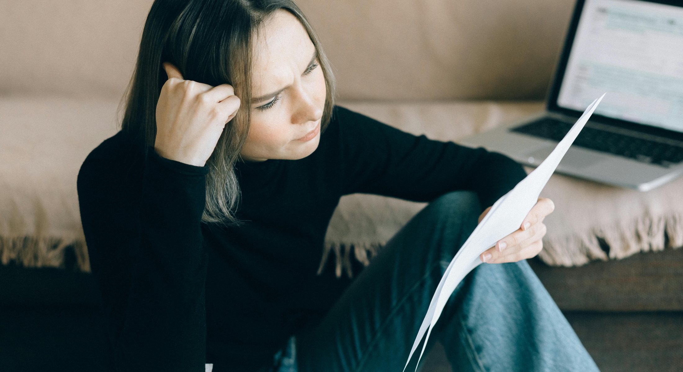 Woman Reading Insurance Documents