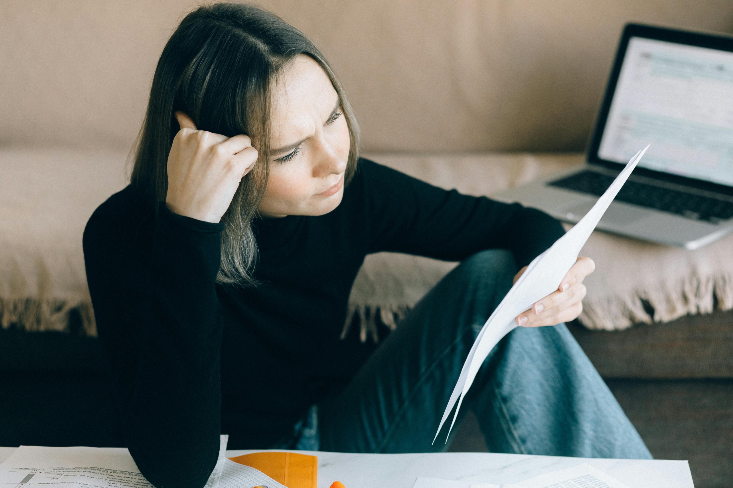 Woman Reading Insurance Documents